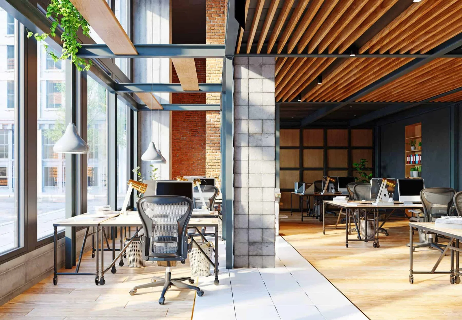 Modern open office with exposed brick, steel beam accents, and a standing desk workstation, interior commercial painting by Lagunas Painting in the Treasure Valley, Idaho