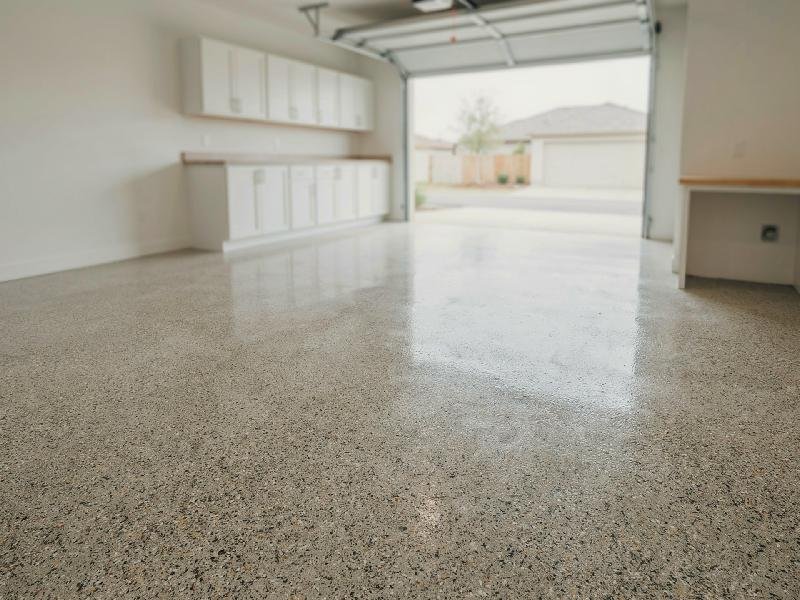 Epoxy flake floor with a speckled blend of decorative color flakes and a glossy clear topcoat, installed by Lagunas Painting in the Treasure Valley, Idaho