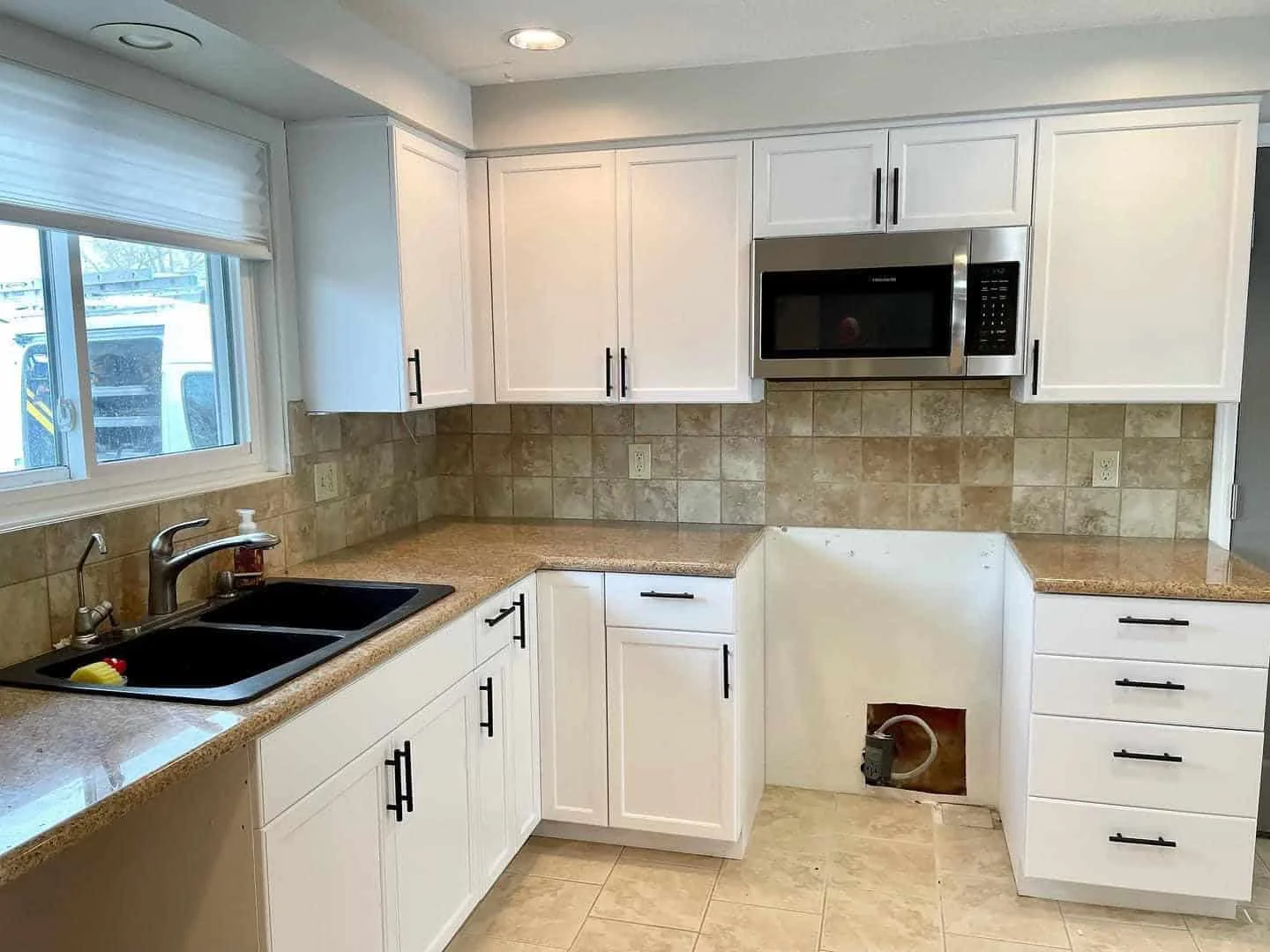 High End Cabinet Painting Services in Caldwell, ID - White painted kitchen cabinets by Lagunas Painting