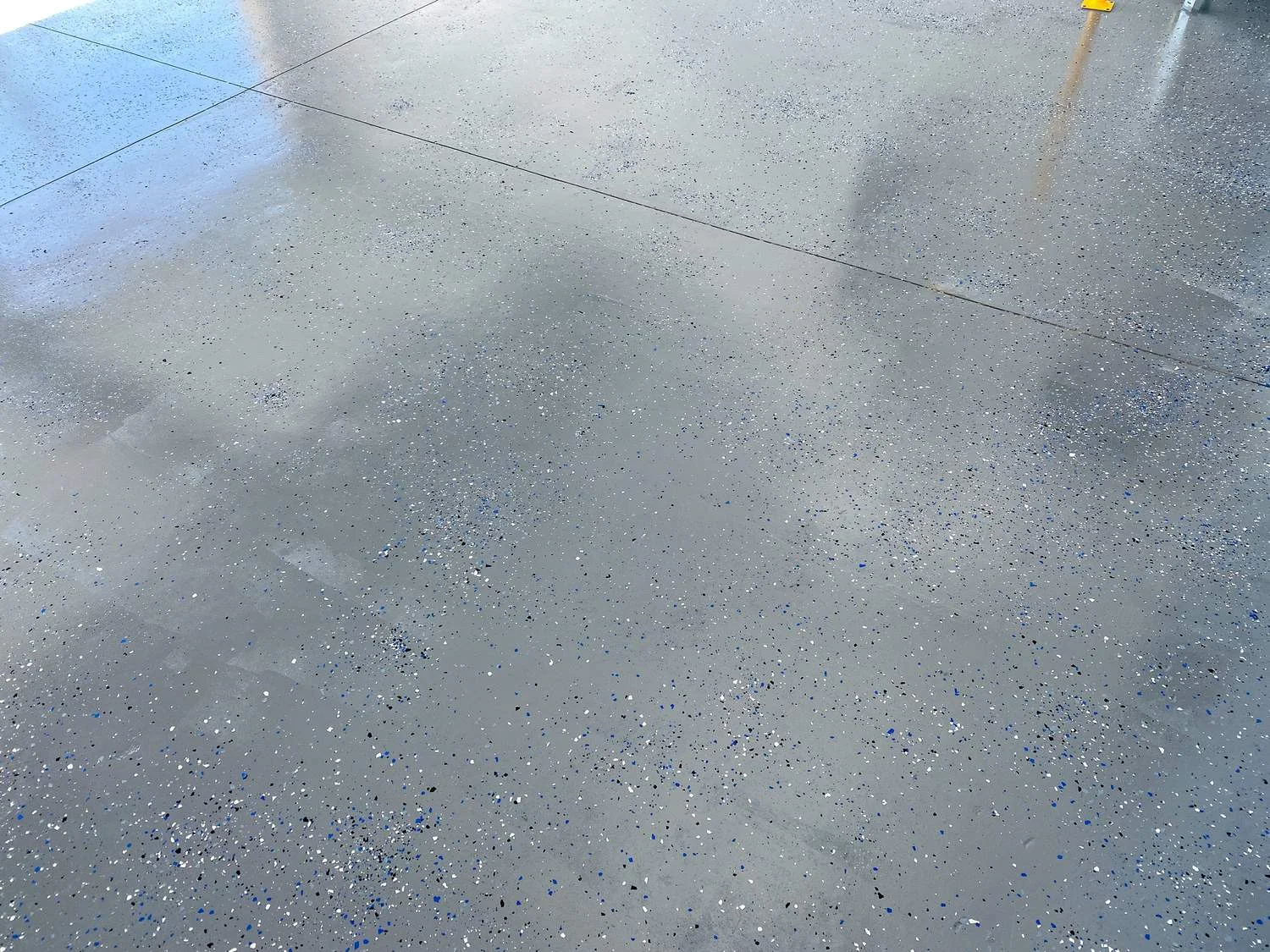 High-end decorative flake concrete floor coating applied by Lagunas Painting