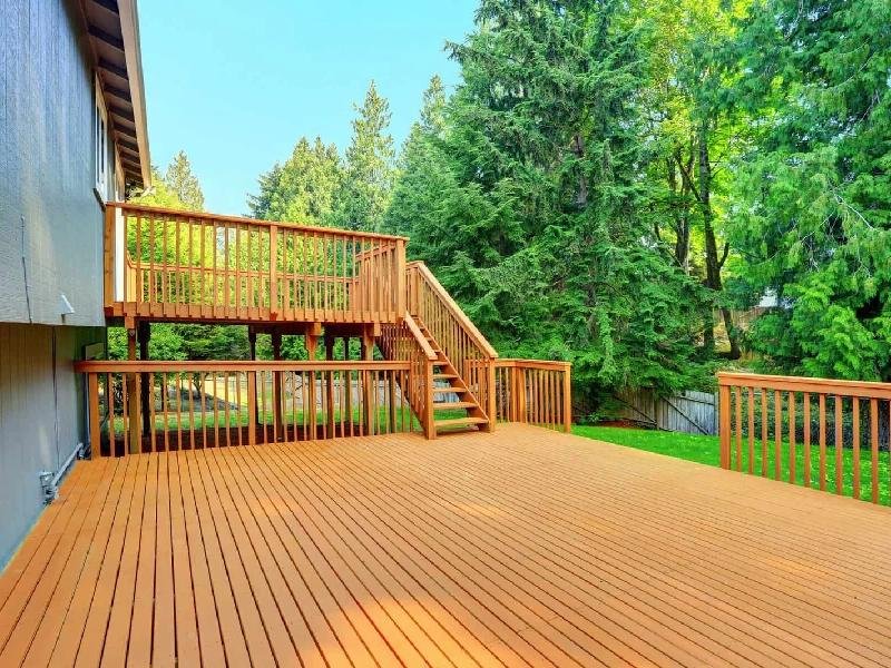 Freshly stained wooden deck with railings and stairs on a home in the Treasure Valley, Idaho, finished by Lagunas Painting